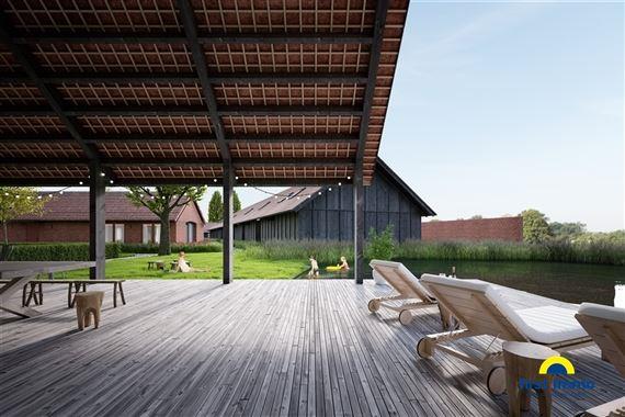 Qville, een woonproject van 1,7 hectare op de site van de voormalige quarantainestallen in Essen, omvat 43 woningen met zwemvijver, wellness met binne ...